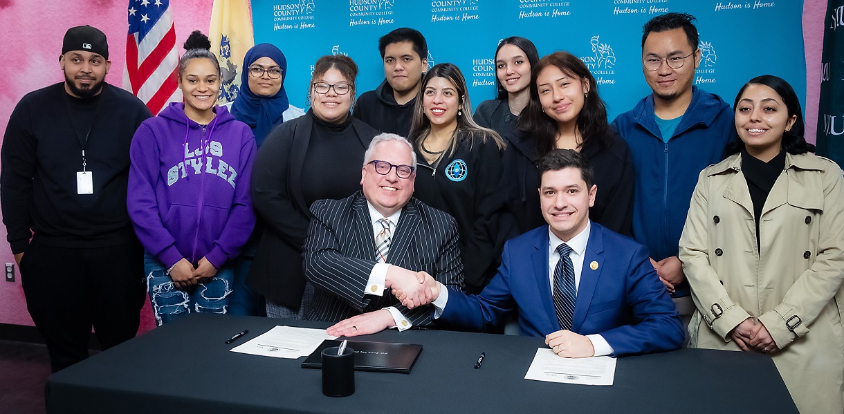 Transfer agreement signage photo with HCCC and NJCU presidents.